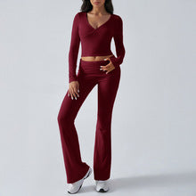 Women's fitted knit wrap top and flare pants set in burgundy