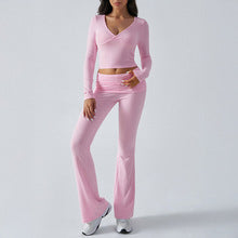 Women's fitted knit wrap top and flare pants set in pink